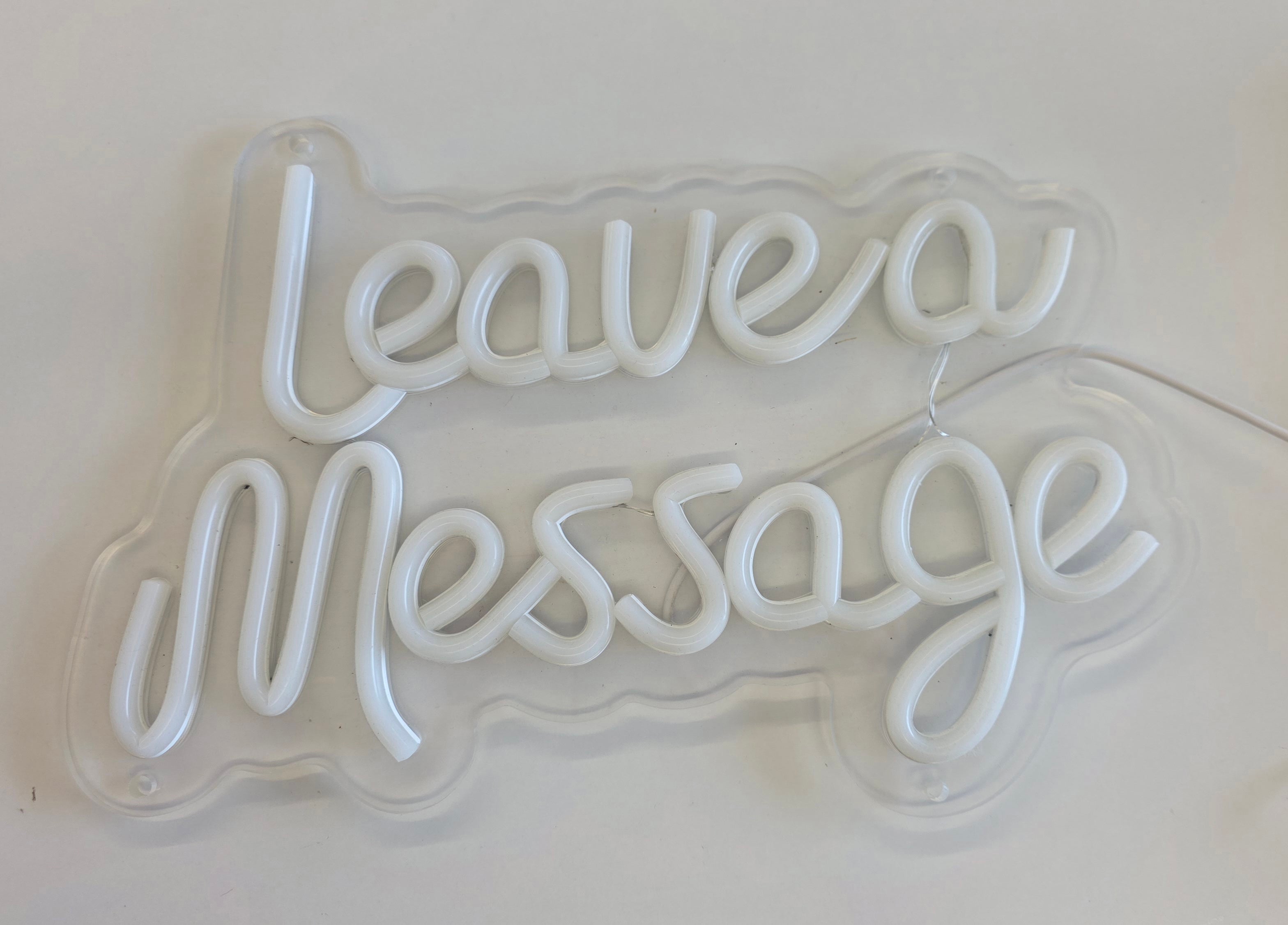 white / Leave a message neon sign